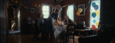 a group of people standing around a table