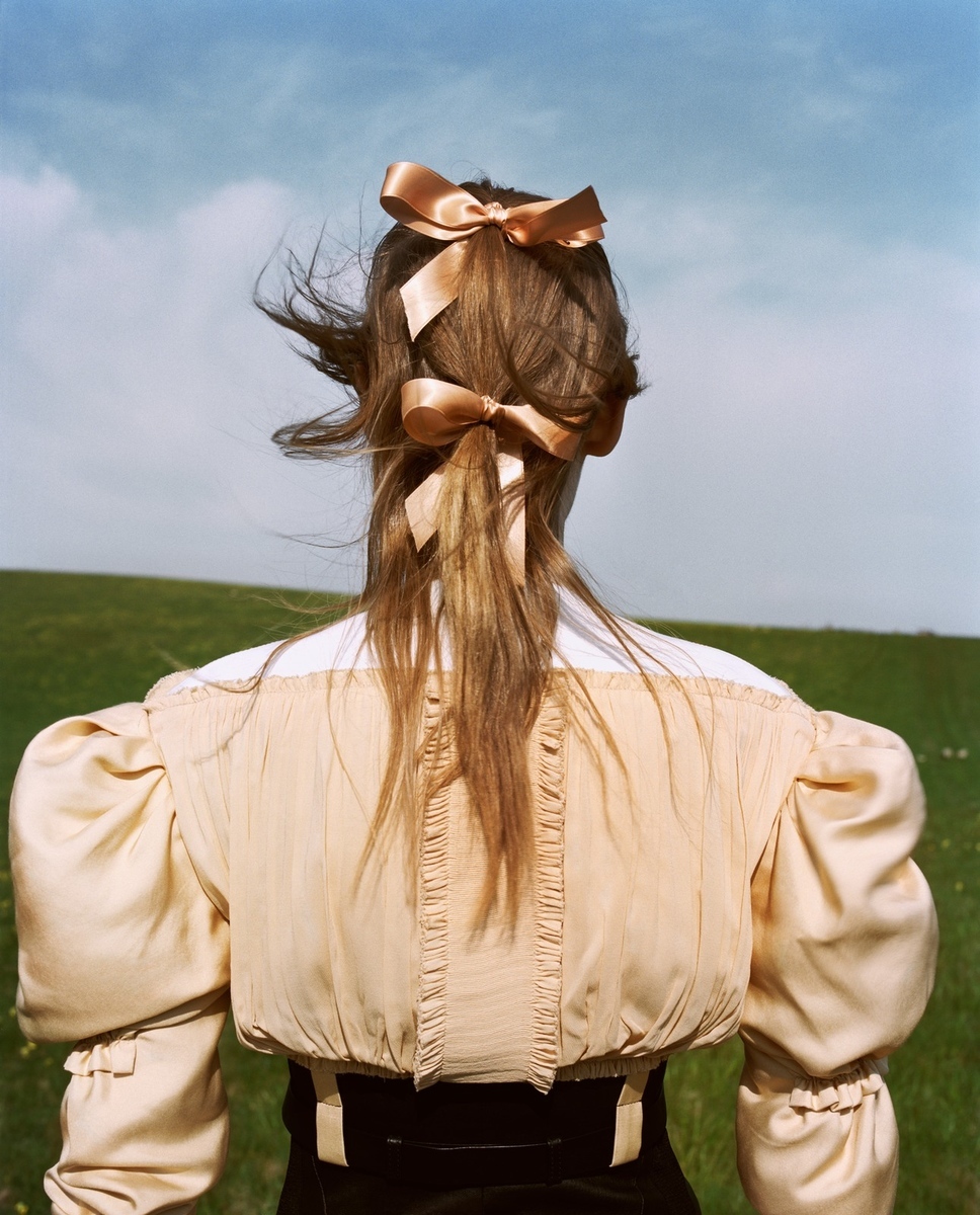 a woman with a bow in her hair