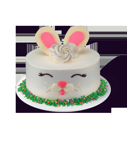 a white cake with a bunny face on top of it