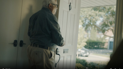 a man standing in front of a white door