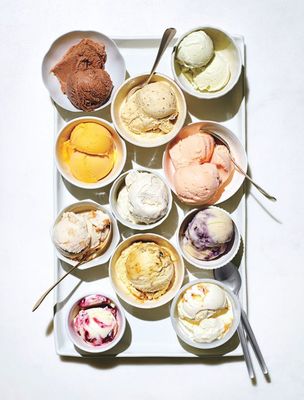 a white tray topped with bowls of ice cream