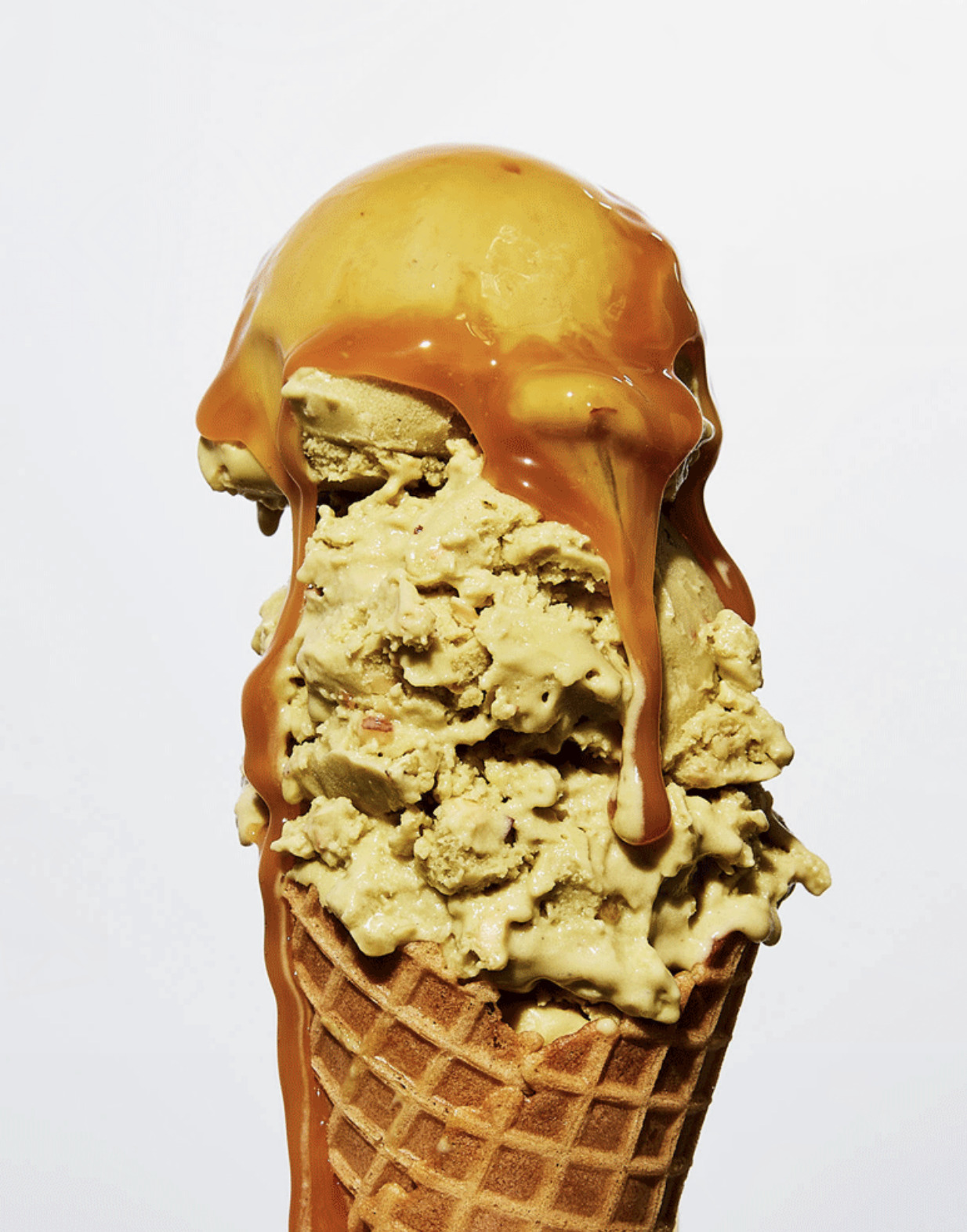 a scoop of ice cream with caramel drizzle on top