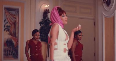 a group of women standing in a room