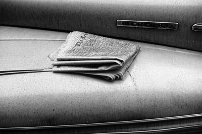 a cloth is laying on the seat of an old car