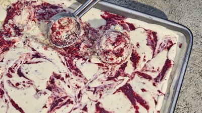 a pan of food that is covered in red and white stuff