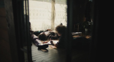 a person laying on the floor reading a book