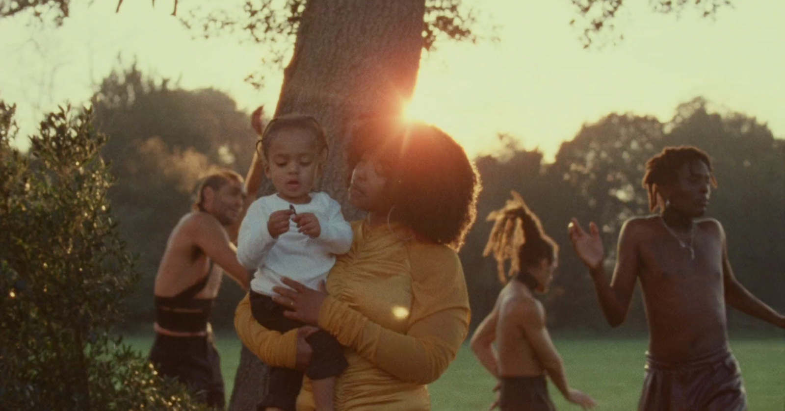 a woman holding a small child in her arms