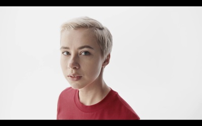 a woman with blonde hair and a red shirt