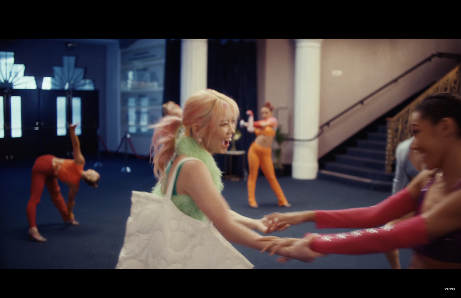 a group of young women dancing in a dance studio