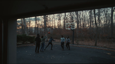 a group of young men playing a game of basketball