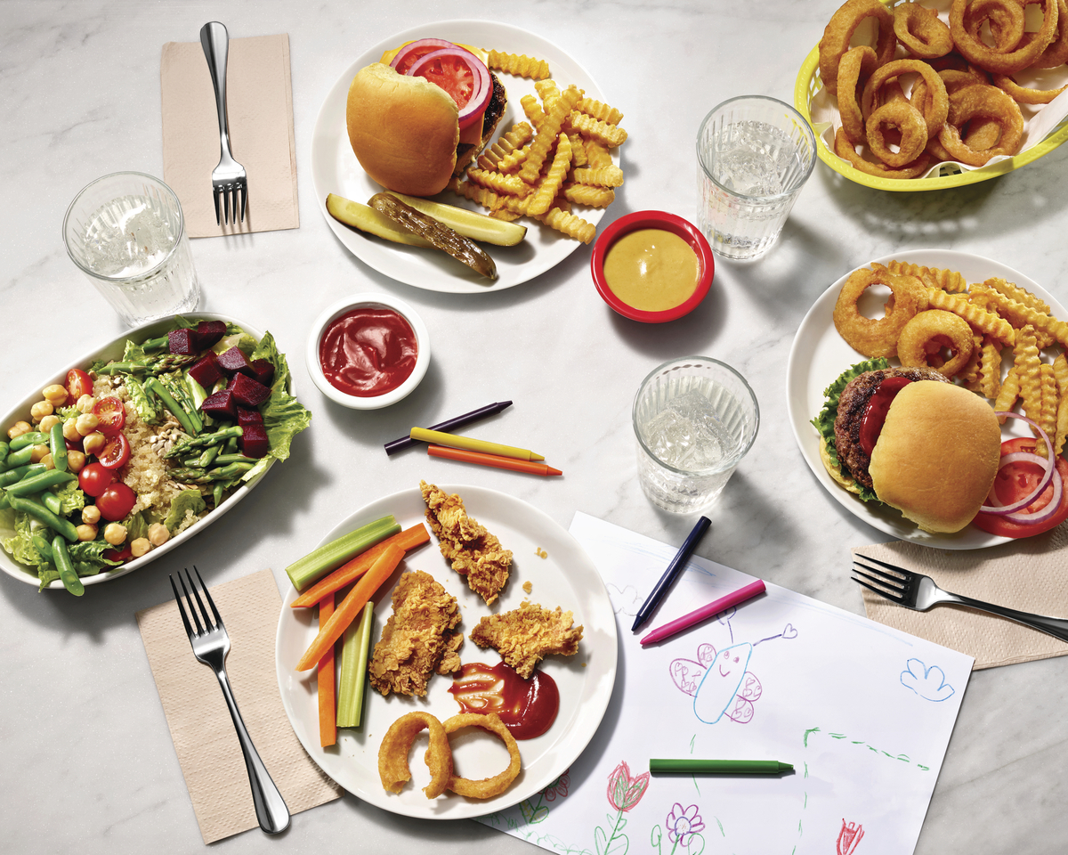 a table topped with plates of food and drinks