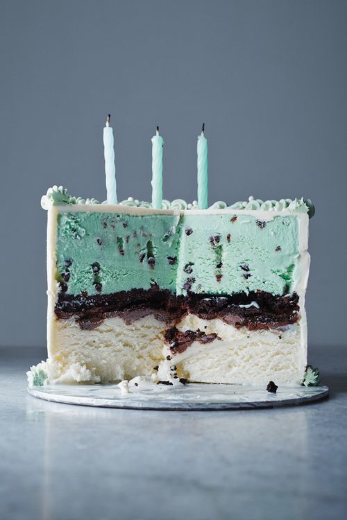 a slice of cake with green and white frosting