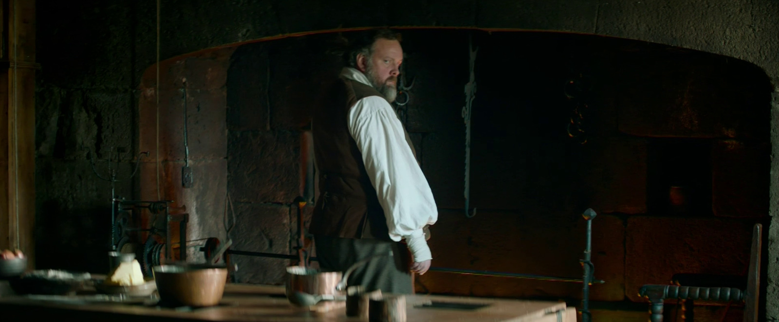 a man standing in front of a mirror in a room