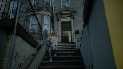 a woman walking down a flight of stairs