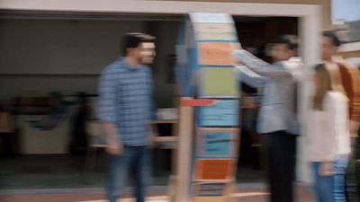 a group of people standing next to each other in front of a building