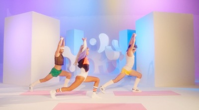 a group of women doing yoga poses in a studio