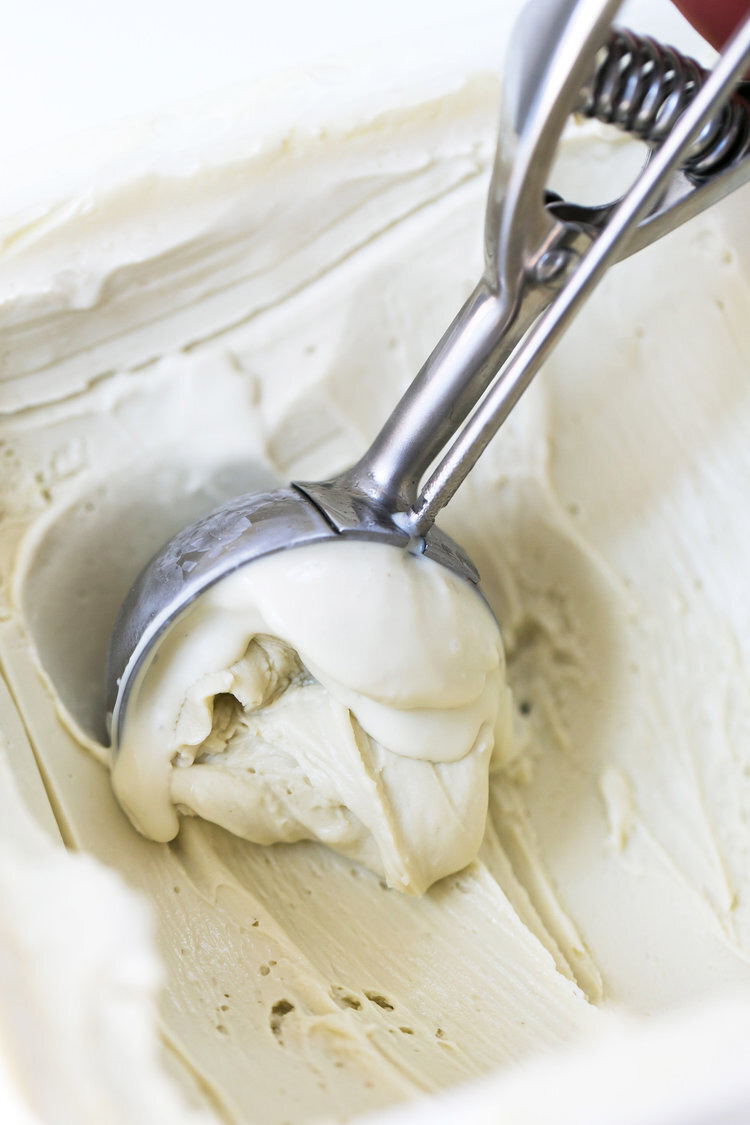 a scoop of ice cream with a red handle