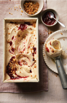 a pan of ice cream with a spoon next to it