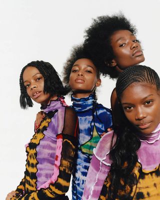 a group of women standing next to each other