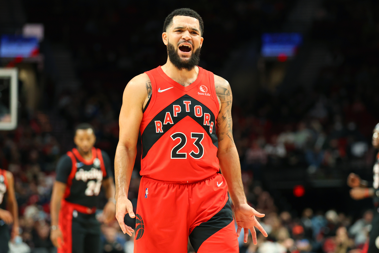 a man with a beard and a beard standing on a basketball court