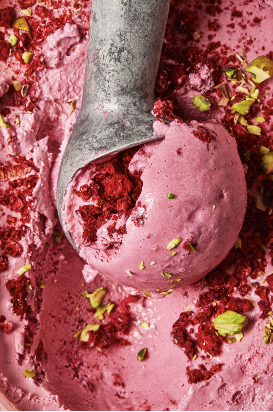 a scoop of pink ice cream in a bowl