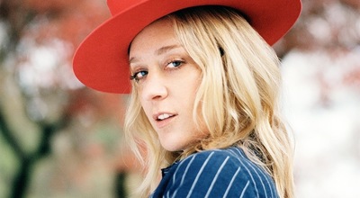 a woman wearing a red hat and a blue shirt