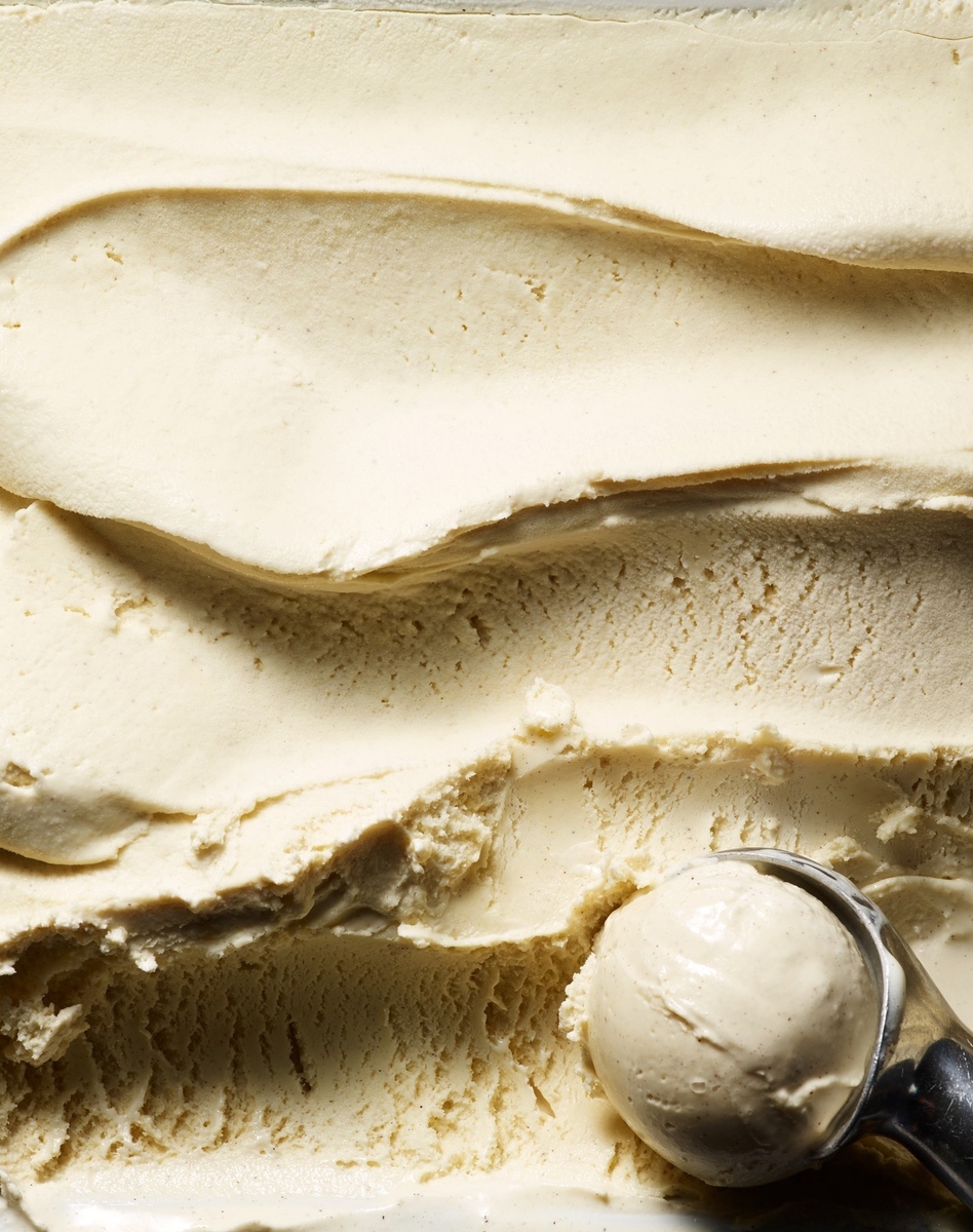 a scoop of ice cream sitting on top of a white plate