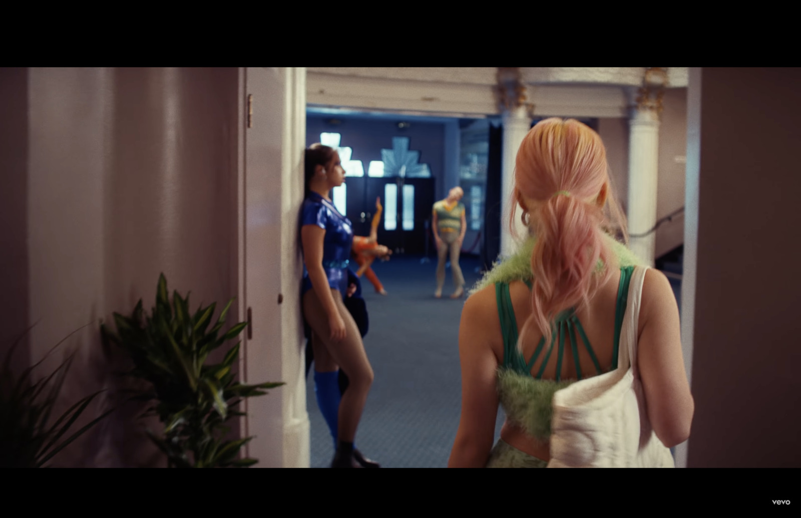 a group of people standing in a hallway