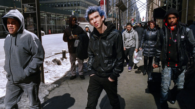 a group of young men walking down a street