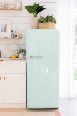 a mint green refrigerator in a white kitchen