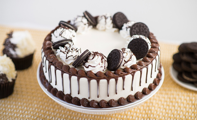 a cake with oreo cookies and cream on it