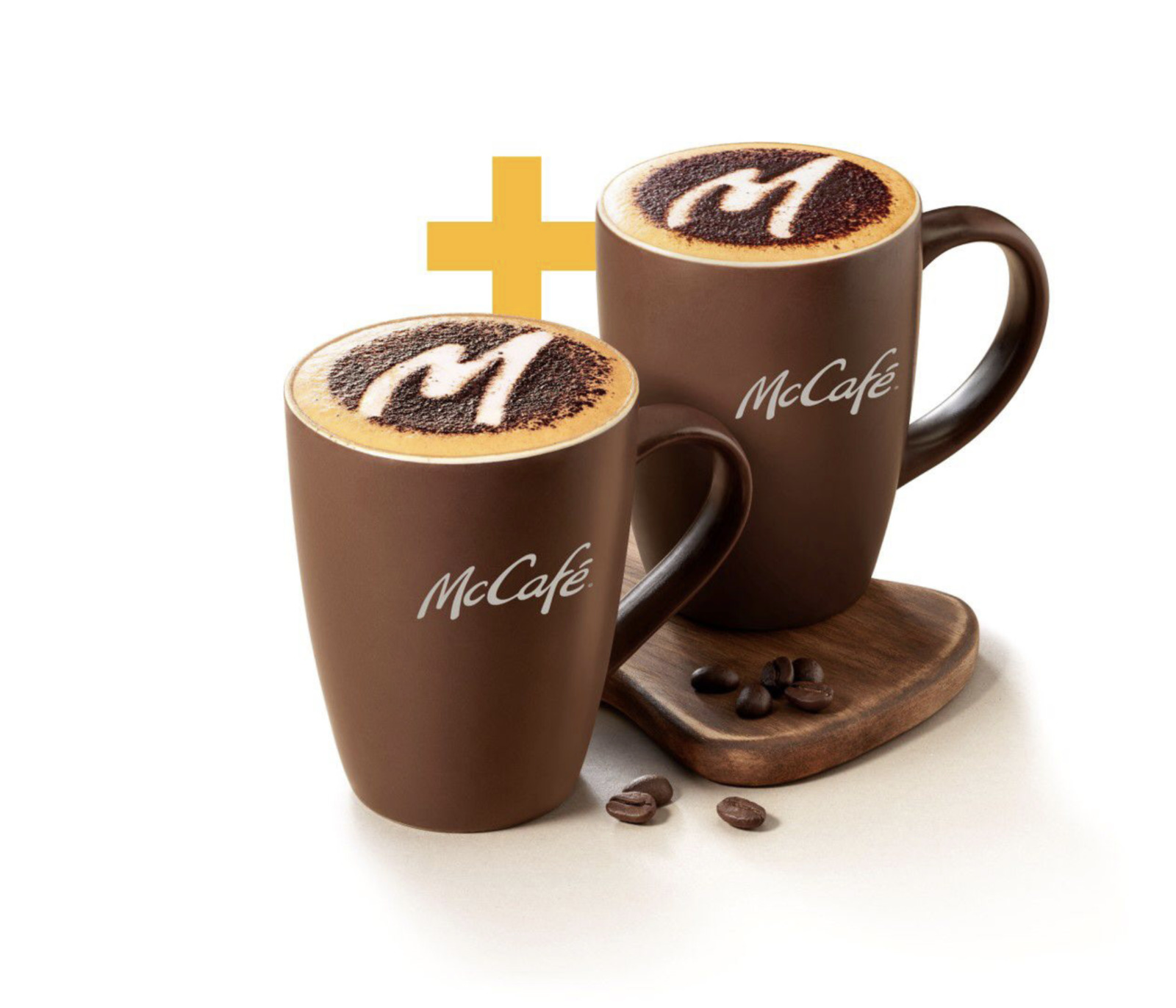 a couple of coffee mugs sitting on top of a wooden tray