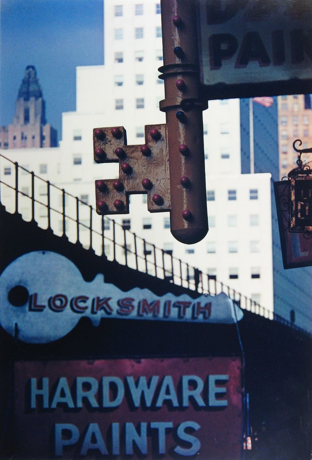 a close up of a street sign with a building in the background