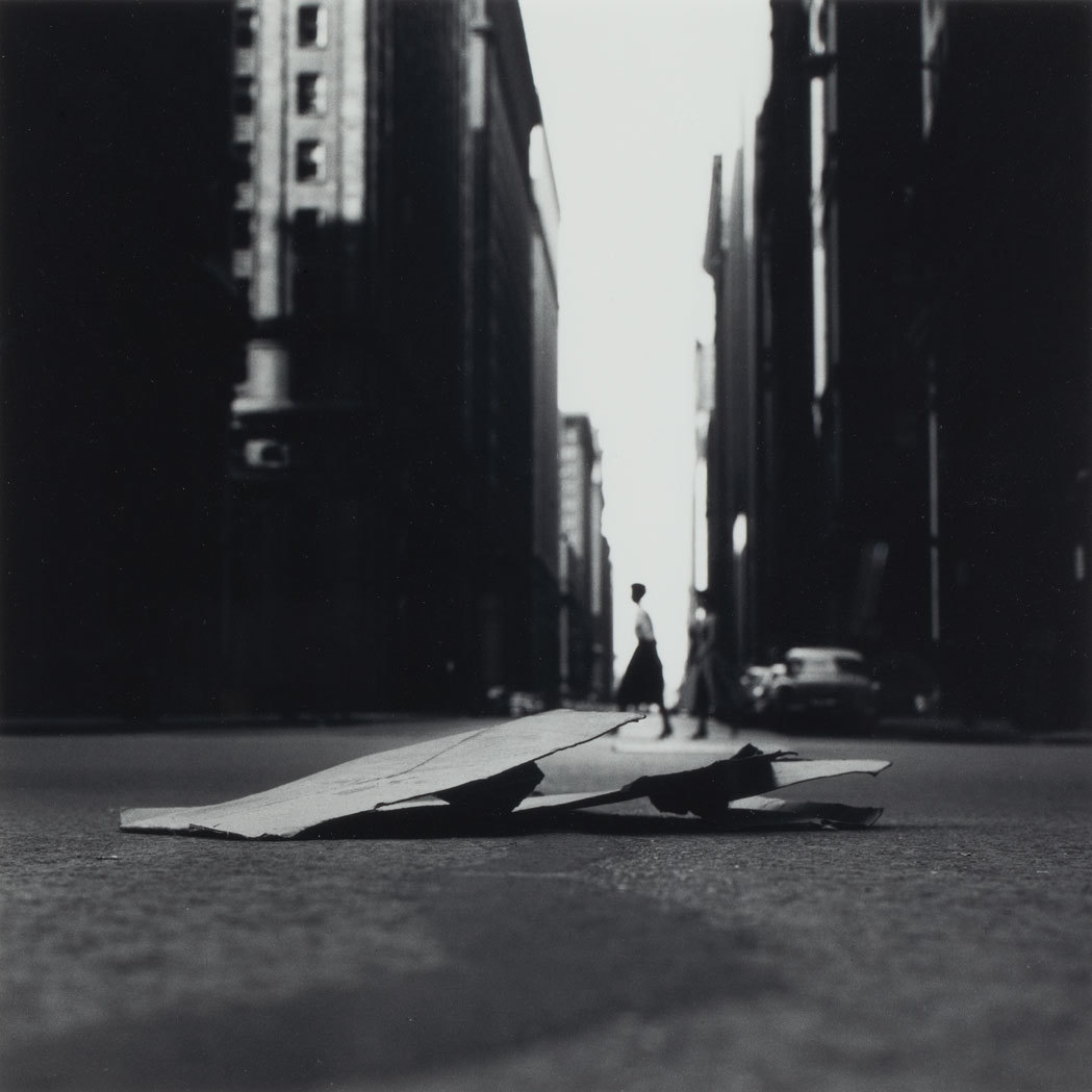 a skateboard laying on the ground in the middle of the street