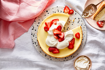 a slice of cheesecake with strawberries on top