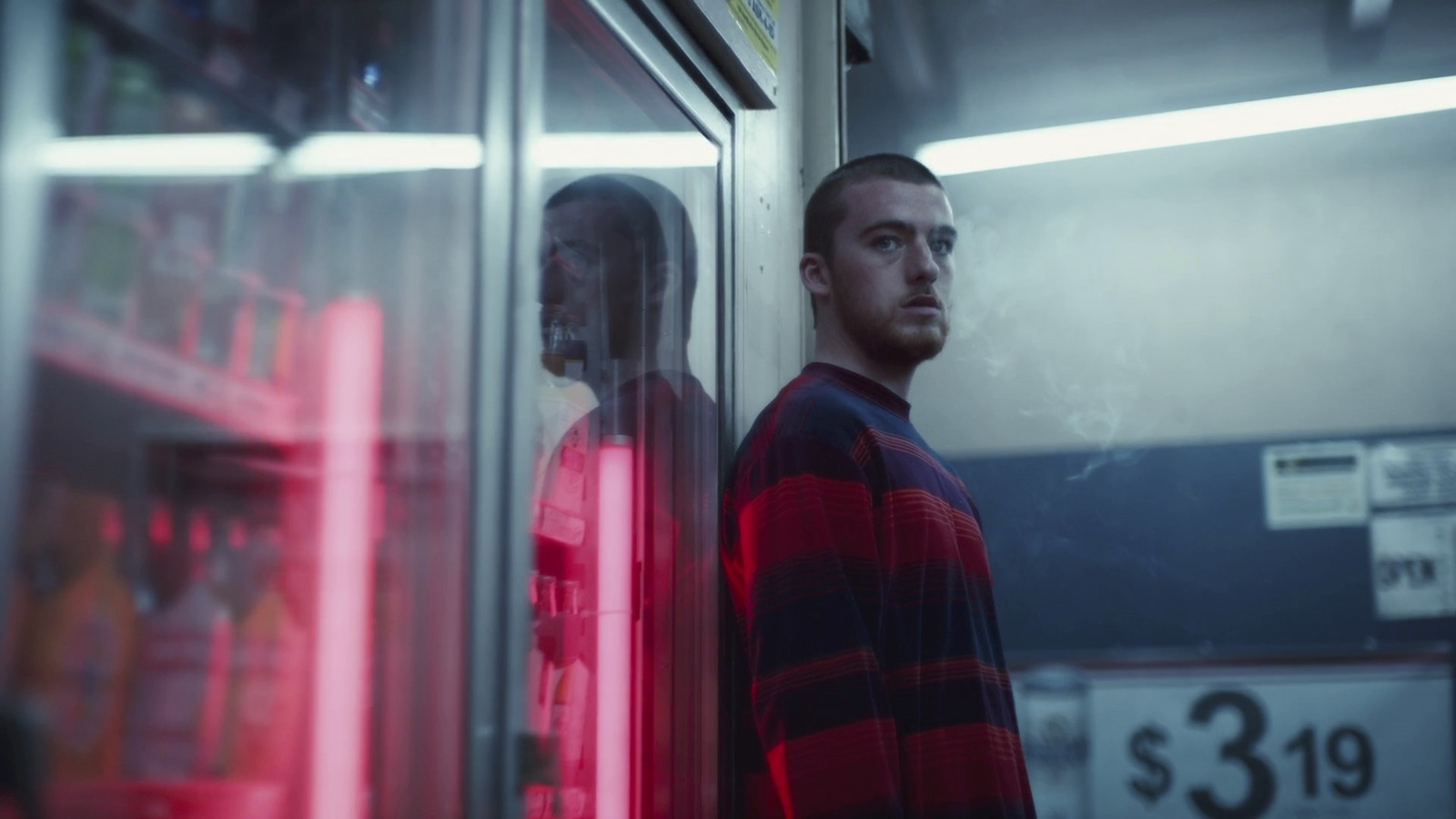 a man standing in front of a mirror in a room