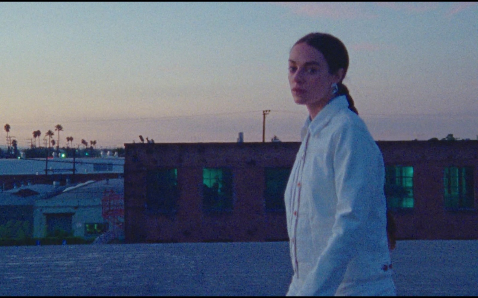 a woman standing in front of a building