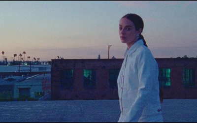 a woman standing in front of a building