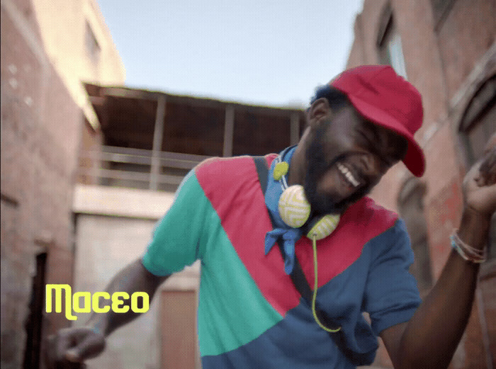 a man wearing headphones and a colorful shirt