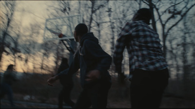 a group of young men playing a game of basketball