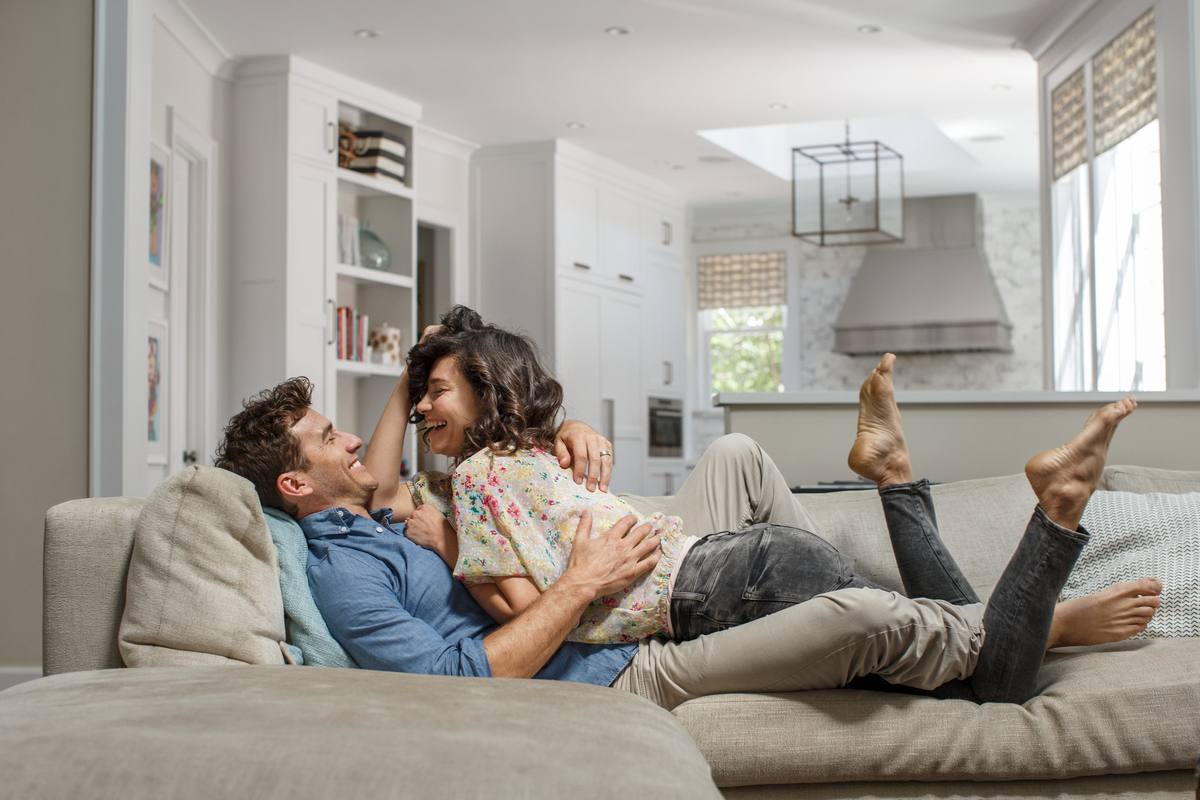 a man and a woman laying on a couch