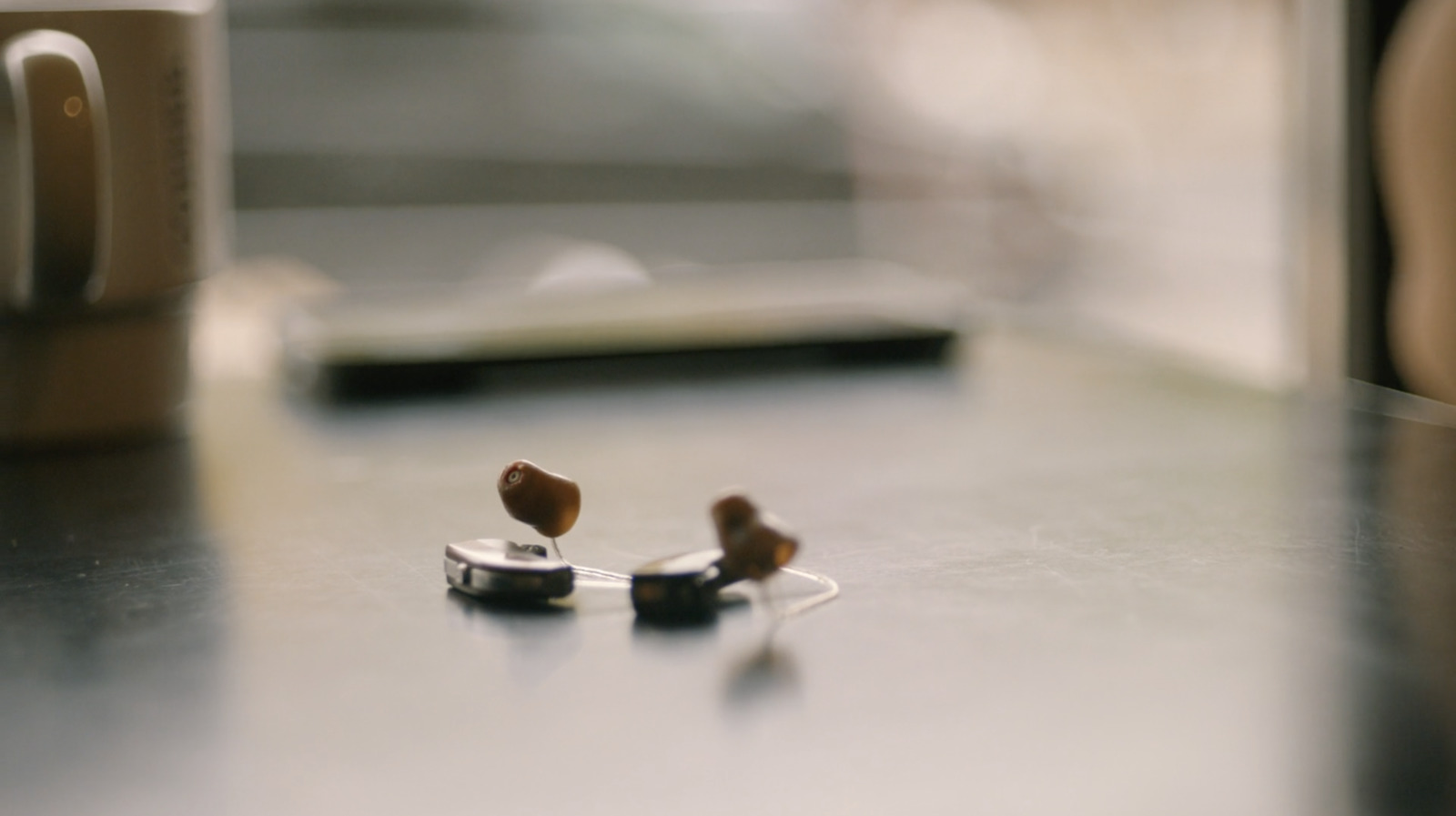 a pair of ear buds sitting on top of a table