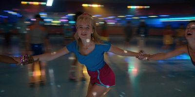 a group of people are dancing on a dance floor