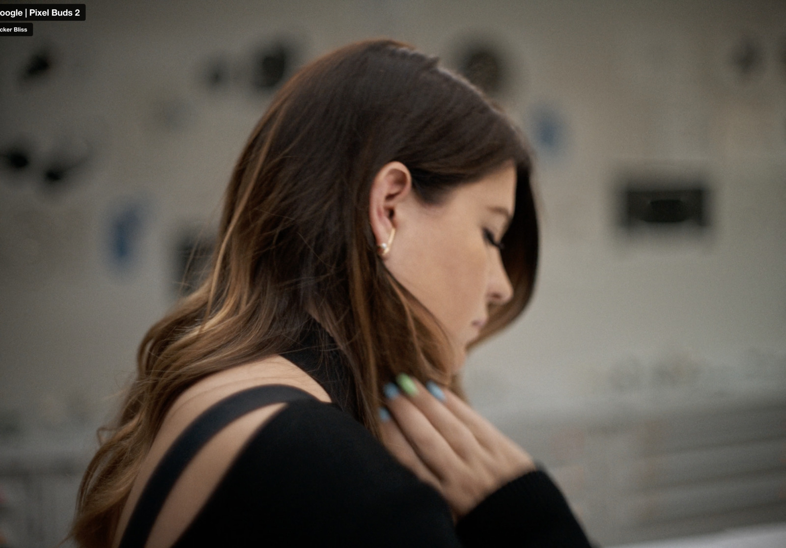 a woman in a black top is looking at her cell phone