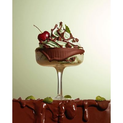 a chocolate dessert with cherries on top of it