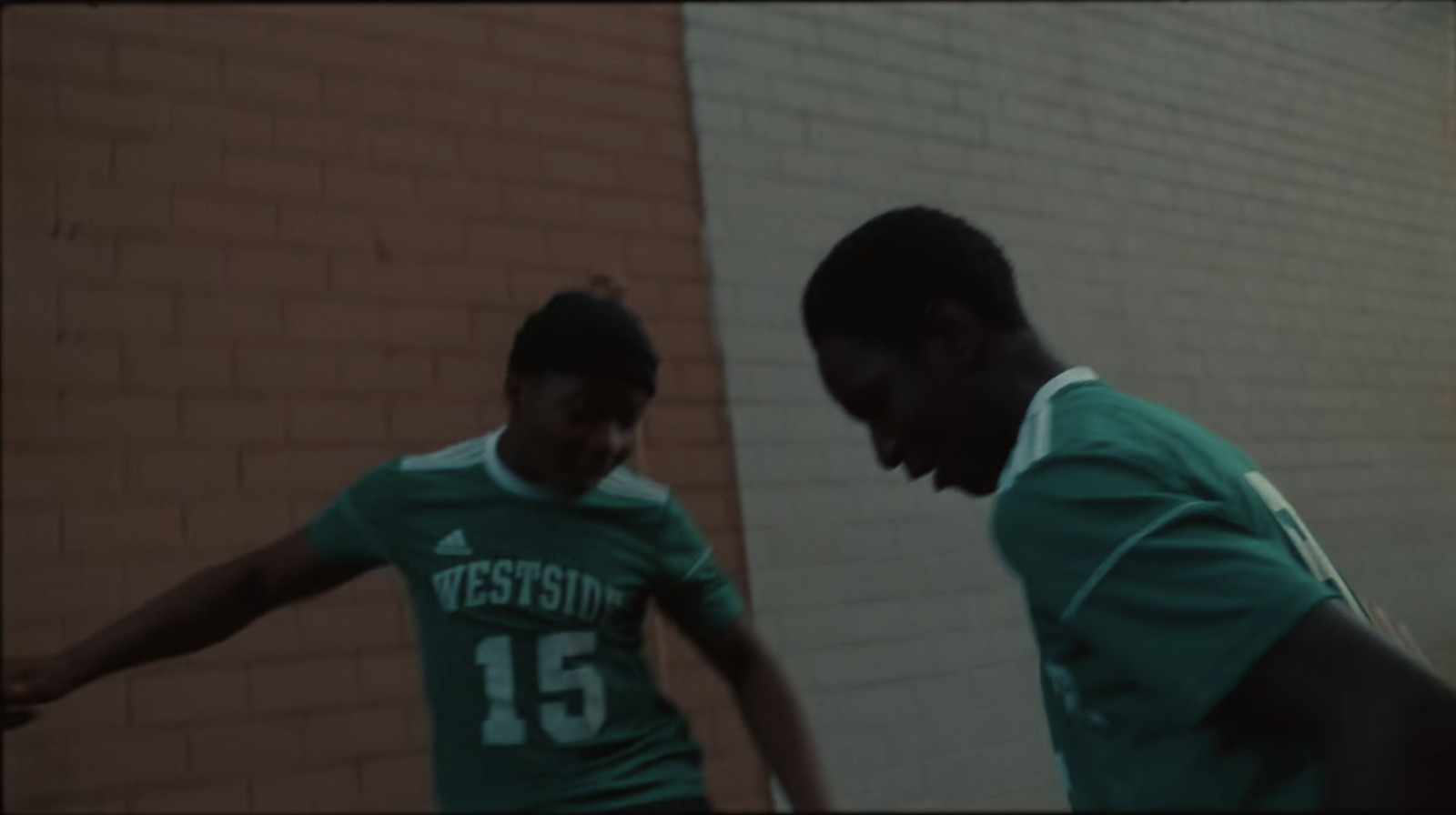 two young men playing a game of soccer