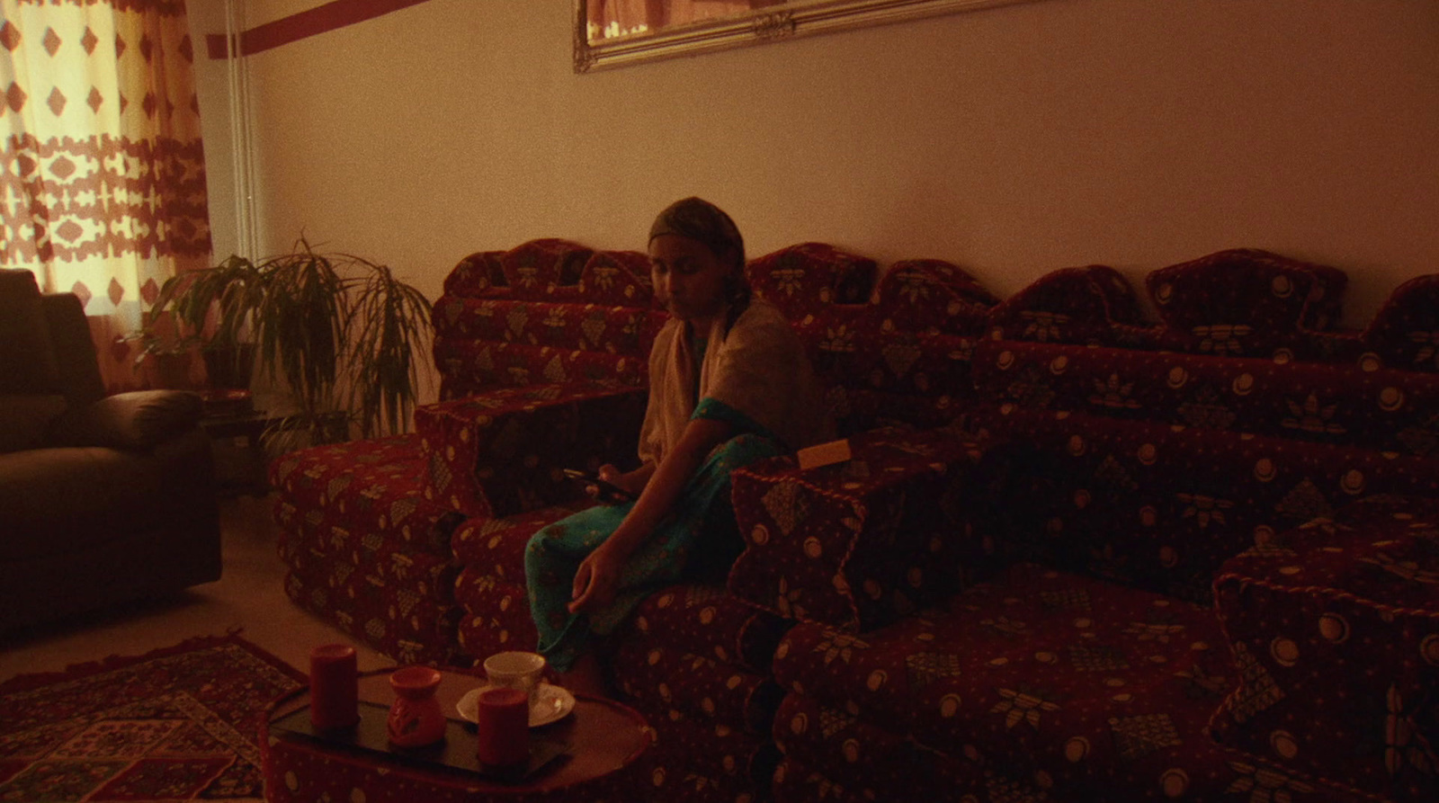 a woman sitting on a couch in a living room