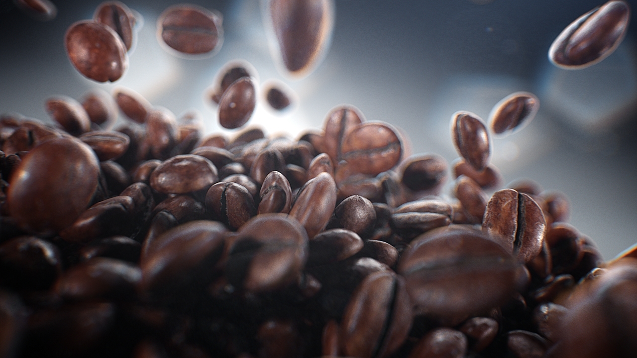 a pile of coffee beans falling into the air