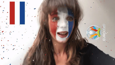 a woman with her face painted in the colors of france