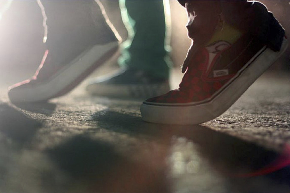 a close up of a person's shoes on the ground